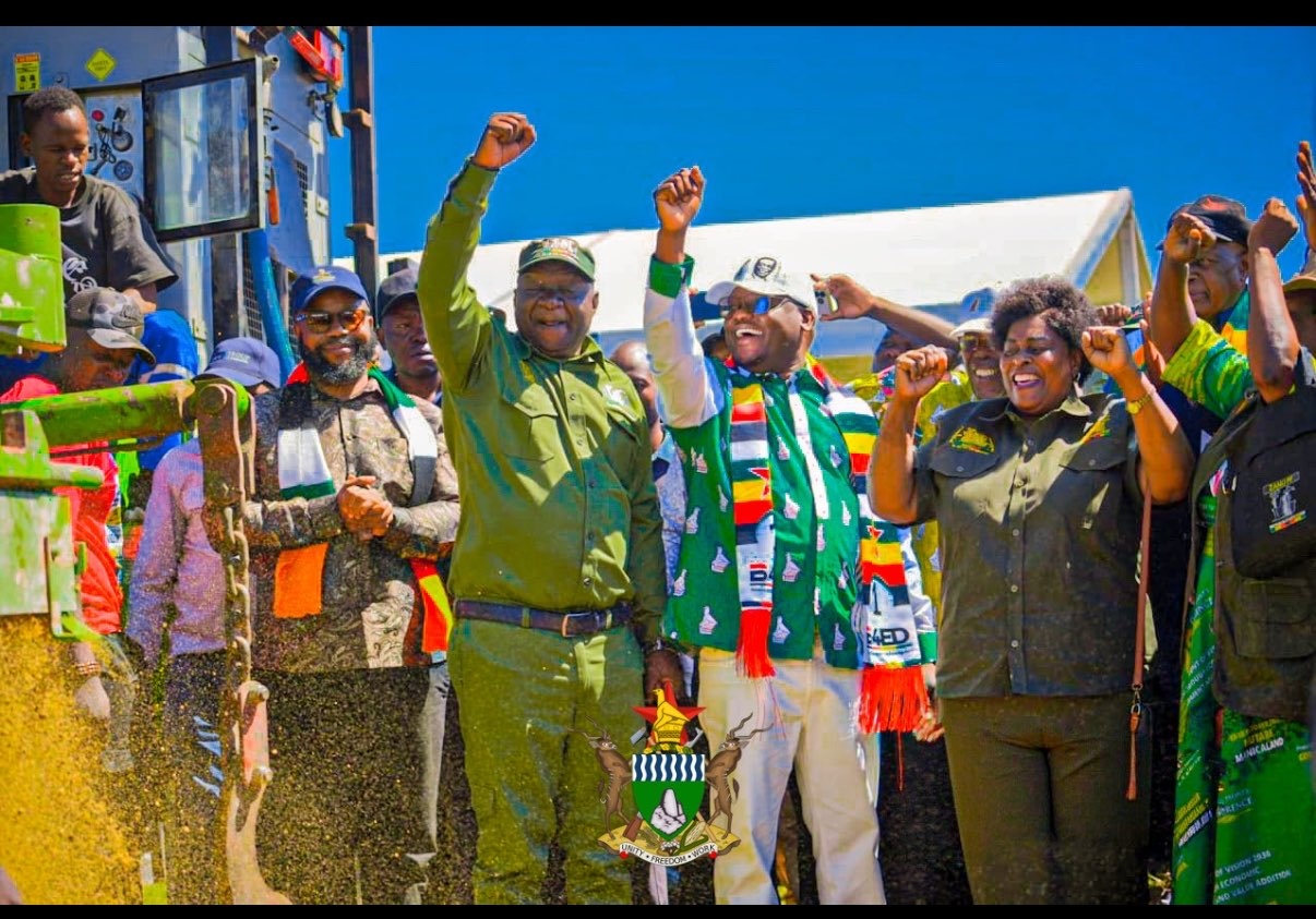 Dr Paul Tungwarara raising his fist alongside President Mnangagwa and First Lady at a Presidential Borehole launch